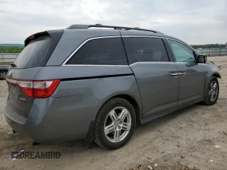 2012 Honda Odyssey Touring with VIN 5FNRL5H96CB045514, listed as a Copart auction lot 54698355 with 217,787 mi miles and Clean Title. Bid and sale history available at DreamBid. Image 3.