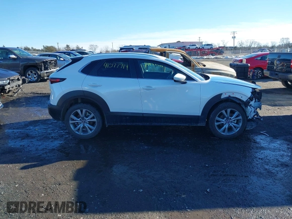 2022 Mazda CX-30 S Select z VIN 3MVDMBBL8NM448787, wystawiony jako IAAI lot #41577914 z przebiegiem 64 552 mil mil oraz . Historia ofert i sprzedaży dostępna na DreamBid. Obrazek 14.