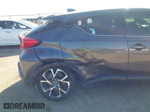 2019 Toyota C-HR XLE with VIN JTNKHMBX1K1062180, listed as a IAAI auction lot 41769979 with 75,159 mi miles. Bid and sale history available at carsss.com. Image 6.