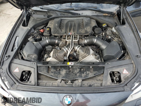 2016 BMW M5 z VIN WBSFV9C51GD595430, wystawiony jako Copart lot #79675834 z przebiegiem 82 351 mil mil oraz Szkoda całkowita • Salvage title. Historia ofert i sprzedaży dostępna na DreamBid. Obrazek 11.