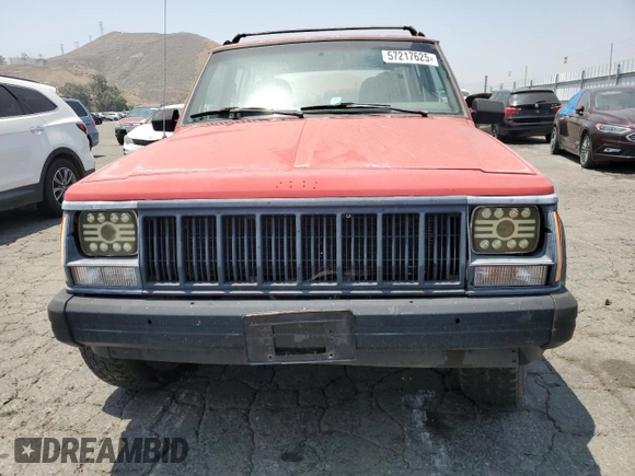 1996 Jeep Cherokee SE with VIN 1J4FT28S3TL213153, listed as a Copart auction lot 57217625 with 331,741 mi miles and Salvage title. Bid and sale history available at DreamBid. Image 5.