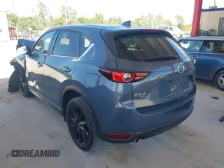 2021 Mazda CX-5 Touring with VIN JM3KFBCM3M0406787, listed as a IAAI auction lot 41800564 with 42,254 mi miles and . Bid and sale history available at carsss.com. Image 3.