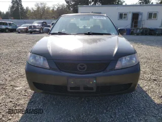 2003 Mazda Protege DX with VIN JM1BJ226231214537, listed as a Copart auction lot 54448615 with 147,753 mi miles and Salvage Title. Bid and sale history available at DreamBid. Image 5.