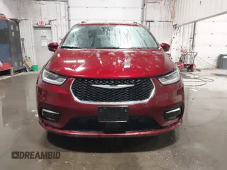 2021 Chrysler Pacifica Hybrid Touring L with VIN 2C4RC1L71MR581260, listed as a IAAI auction lot 42014401 with 68,719 mi miles and . Bid and sale history available at DreamBid. Image 12.