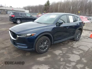 2021 Mazda CX-5 Touring with VIN JM3KFBCM7M1380396, listed as a IAAI auction lot 41707612 with 55,555 mi miles. Bid and sale history available at carsss.com. Image 2.