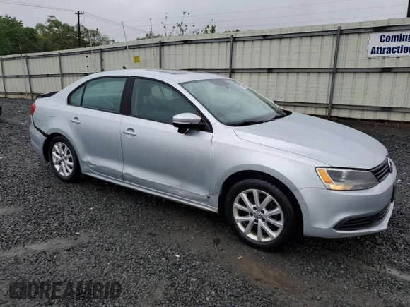 2011 Volkswagen Jetta SE with VIN 3VWDZ7AJ5BM319091, listed as a Copart auction lot 57991585 with 185,458 mi miles and Salvage title. Bid and sale history available at DreamBid. Image 4.