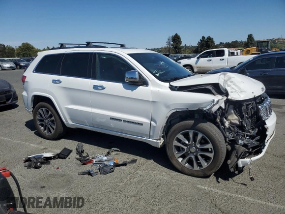 2017 Jeep Grand Cherokee Overland with VIN 1C4RJFCT5HC777748, listed as a Copart auction lot 63121635 with 106,991 mi miles and Salvage title. Bid and sale history available at DreamBid. Image 4.