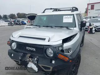 2007 Toyota FJ Cruiser with VIN JTEBU11F370036941, listed as a IAAI auction lot 42024330 with 164,703 mi miles. Bid and sale history available at carsss.com. Image 2.