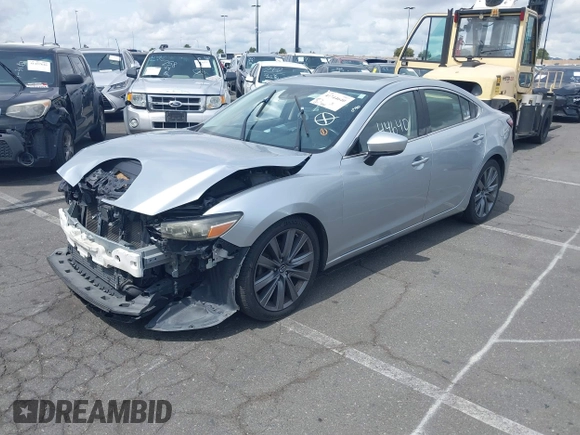 2018 Mazda 6 Grand Touring with VIN JM1GL1TY0J1306768, listed as a IAAI auction lot 41744640 with 81,798 mi miles and . Bid and sale history available at DreamBid. Image 2.