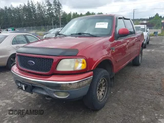 2001 Ford F-150 XLT with VIN 1FTRW08L91KE59120, listed as a IAAI auction lot 42301677 with Not provided miles and . Bid and sale history available at DreamBid. Image 2.
