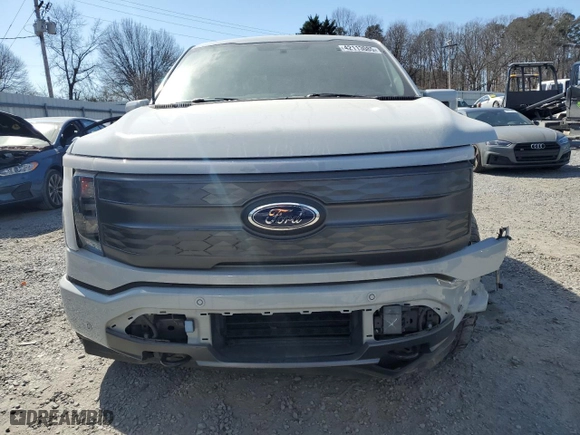 2023 Ford F-150 Lightning Pro with VIN 1FT6W1EV7PWG06857, listed as a Copart auction lot 42113085 with 28,124 mi miles and Salvage Title. Bid and sale history available at carsss.com. Image 5.