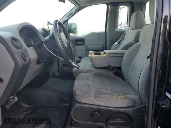 2007 Ford F-150 STX with VIN 1FTRF02297KD15057, listed as a Copart auction lot 73847974 with 184,413 mi miles and Salvage Title. Bid and sale history available at carsss.com. Image 7.