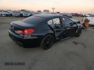 2015 BMW 6 Series 640i z VIN WBA6A0C59FD318390, wystawiony jako Copart lot #87831165 z przebiegiem Nie podano mil oraz Szkoda całkowita • Salvage title. Historia ofert i sprzedaży dostępna na DreamBid. Obrazek 3.