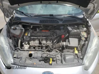 2014 Ford Fiesta SE z VIN 3FADP4BJ8EM133030, wystawiony jako Copart lot #52046065 z przebiegiem 113 792 mil mil oraz Szkoda całkowita • Salvage title. Historia ofert i sprzedaży dostępna na DreamBid. Obrazek 11.