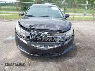 2014 Chevrolet Cruze 1LT z VIN 1G1PC5SBXE7178264, wystawiony jako IAAI lot #42387875 z przebiegiem 125 437 mil mil oraz . Historia ofert i sprzedaży dostępna na DreamBid. Obrazek 6.