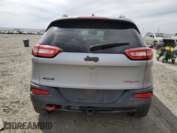 2014 Jeep Cherokee Trailhawk with VIN 1C4PJMBS6EW159174, listed as a Copart auction lot 56097795 with 130,299 mi miles and Salvage title. Bid and sale history available at DreamBid. Image 6.