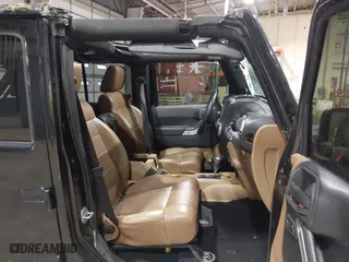2011 Jeep Wrangler Unlimited Sahara with VIN 1J4HA5H12BL557059, listed as a IAAI auction lot 41856882 with 150,683 mi miles. Bid and sale history available at carsss.com. Image 5.