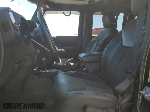 2015 Jeep Wrangler Unlimited Freedom with VIN 1C4HJWDG0FL598947, listed as a Copart auction lot 61794214 with 125,778 mi miles and Salvage title. Bid and sale history available at DreamBid. Image 7.