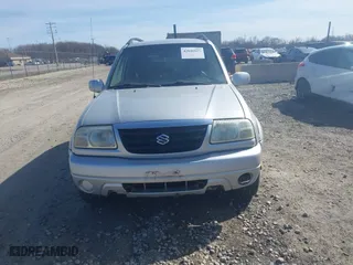 2003 Suzuki Grand Vitara with VIN JS3TD62V734105601, listed as a IAAI auction lot 42046825 with 210,728 mi miles. Bid and sale history available at carsss.com. Image 6.