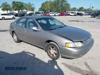 1999 Nissan Altima XE with VIN 1N4DL01D1XC255927, listed as a IAAI auction lot 42003101 with 154,000 mi miles. Bid and sale history available at carsss.com. Image 1.