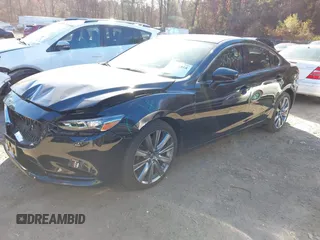 2018 Mazda 6 Grand Touring with VIN JM1GL1TY0J1319083, listed as a IAAI auction lot 40852818 with 57,408 mi miles and . Bid and sale history available at DreamBid. Image 17.