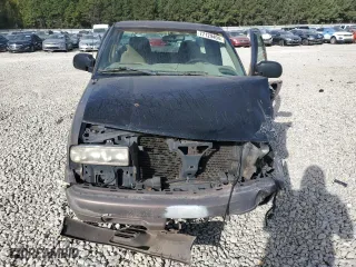 1999 Chevrolet S-10 LS with VIN 1GCCS19X7XK189242, listed as a Copart auction lot 77129404 with 208,281 mi miles and Salvage Title. Bid and sale history available at carsss.com. Image 5.
