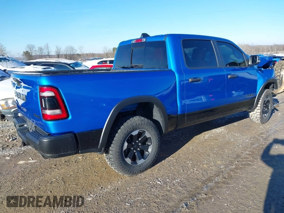 2022 Ram 1500 Rebel z VIN 1C6SRFLT0NN177124, wystawiony jako IAAI lot #41575076 z przebiegiem 40 065 mil mil oraz . Historia ofert i sprzedaży dostępna na DreamBid. Obrazek 4.