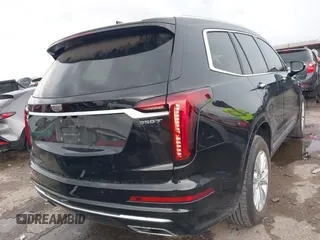 2023 Cadillac XT6 FWD Luxury z VIN 1GYKPAR43PZ147512, wystawiony jako IAAI lot #42175720 z przebiegiem 31 520 mil mil oraz . Historia ofert i sprzedaży dostępna na DreamBid. Obrazek 4.