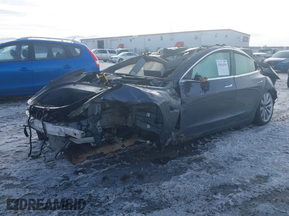 2020 Tesla Model 3 Long Range z VIN 5YJ3E1EB9LF787390, wystawiony jako IAAI lot #41614394 z przebiegiem Nie podano mil oraz . Historia ofert i sprzedaży dostępna na DreamBid. Obrazek 16.