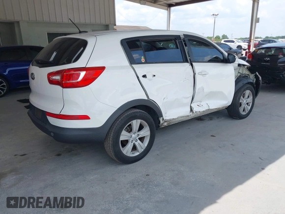 2013 Kia Sportage LX z VIN KNDPB3A2XD7521010, wystawiony jako IAAI lot #42297975 z przebiegiem 134 826 mil mil oraz . Historia ofert i sprzedaży dostępna na DreamBid. Obrazek 4.