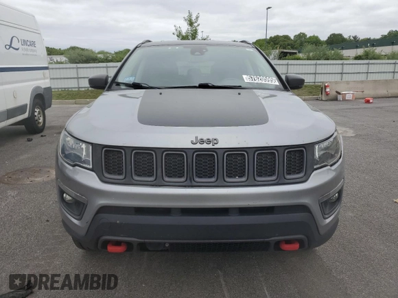 2021 Jeep Compass Trailhawk z VIN 3C4NJDDBXMT565063, wystawiony jako Copart lot #57620595 z przebiegiem 125 956 mil mil oraz Czysty tytuł • Clean title. Historia ofert i sprzedaży dostępna na DreamBid. Obrazek 5.