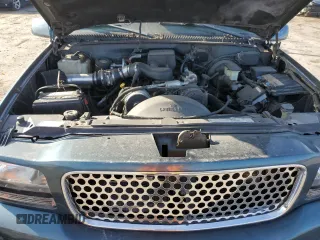 1999 GMC Denali z VIN 1GKEK13R3XR908307, wystawiony jako Copart lot #78595094 z przebiegiem 138 098 mil mil oraz Szkody całkowita. Historia ofert i sprzedaży dostępna na DreamBid. Obrazek 12.