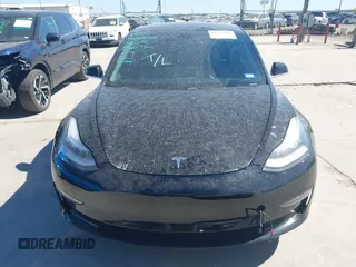 2020 Tesla Model 3 Standard Range Plus with VIN 5YJ3E1EAXLF614002, listed as a IAAI auction lot 41758898 with 42,363 mi miles and . Bid and sale history available at DreamBid. Image 12.
