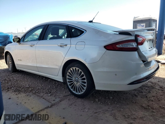 2013 Ford Fusion Titanium Hybrid z VIN 3FA6P0RUXDR376633, wystawiony jako Copart lot #57685555 z przebiegiem 133 248 mil mil oraz Szkoda całkowita • Salvage title. Historia ofert i sprzedaży dostępna na DreamBid. Obrazek 2.