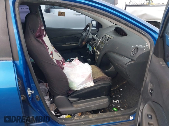 2009 Toyota Yaris with VIN JTDBT903591323255, listed as a IAAI auction lot 41933401 with 88,558 mi miles and . Bid and sale history available at DreamBid. Image 5.