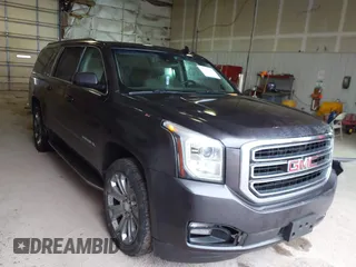 2015 GMC Yukon XL SLT with VIN 1GKS2HKC6FR667110, listed as a IAAI auction lot 41472250 with 141,383 mi miles. Bid and sale history available at carsss.com. Image 1.