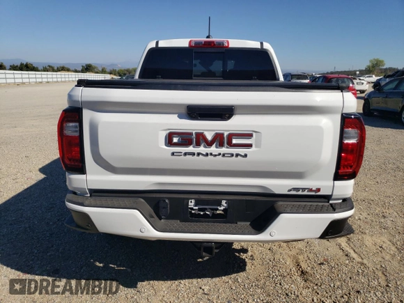 2024 GMC Canyon 4WD AT4 with VIN 1GTP6DEK1R1144016, listed as a Copart auction lot 74384234 with 112 mi miles and Salvage Title. Bid and sale history available at carsss.com. Image 6.