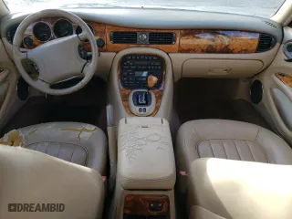 1999 Jaguar XJ with VIN SAJHD1048XC867723, listed as a Copart auction lot 76745444 with 170,999 mi miles and Salvage Title. Bid and sale history available at carsss.com. Image 8.