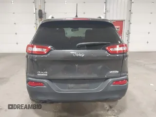 2014 Jeep Cherokee Altitude with VIN 1C4PJMCB2EW317346, listed as a IAAI auction lot 41861651 with 100,602 mi miles. Bid and sale history available at carsss.com. Image 16.