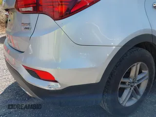 2018 Hyundai Santa Fe 2.4L z VIN 5XYZTDLB1JG546708, wystawiony jako IAAI lot #42399917 z przebiegiem 131 932 mil mil oraz . Historia ofert i sprzedaży dostępna na DreamBid. Obrazek 17.