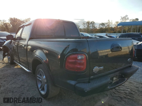 2002 Ford F-150 Harley Davidson with VIN 1FTRW07342KC24210, listed as a Copart auction lot 78489224 with 203,508 mi miles and Salvage Title. Bid and sale history available at carsss.com. Image 2.