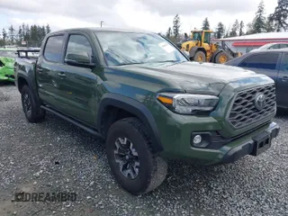 2021 Toyota Tacoma 4WD SR with VIN 3TMCZ5AN5MM437358, listed as a IAAI auction lot 42000234 with 47,295 mi miles. Bid and sale history available at carsss.com. Image 1.