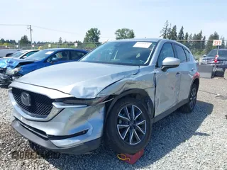 2018 Mazda CX-5 Grand Touring z VIN JM3KFADM7J0318684, wystawiony jako IAAI lot #42226937 z przebiegiem 69 166 mil mil oraz . Historia ofert i sprzedaży dostępna na DreamBid. Obrazek 6.