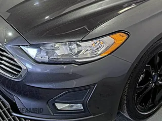 2020 Ford Fusion SE z VIN 3FA6P0HD6LR189762, wystawiony jako IAAI lot #42780149 z przebiegiem 51 099 mil mil oraz . Historia ofert i sprzedaży dostępna na DreamBid. Obrazek 18.