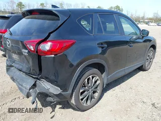 2016 Mazda CX-5 Grand Touring with VIN JM3KE4DY8G0639570, listed as a IAAI auction lot 42098512 with 126,541 mi miles and . Bid and sale history available at carsss.com. Image 4.