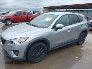 2014 Mazda CX-5 Touring z VIN JM3KE2CY8E0369145, wystawiony jako IAAI lot #42462985 z przebiegiem 155 480 mil mil oraz . Historia ofert i sprzedaży dostępna na DreamBid. Obrazek 6.