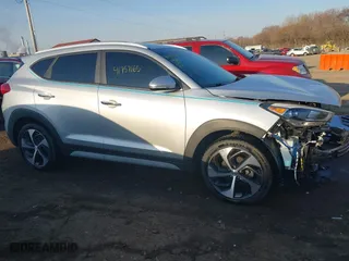2018 Hyundai Tucson Value with VIN KM8J3CA23JU651464, listed as a IAAI auction lot 41757165 with 72,339 mi miles. Bid and sale history available at carsss.com. Image 14.