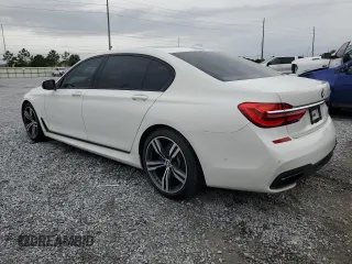 2016 BMW 7 Series 740i with VIN WBA7E2C52GG547112, listed as a Copart auction lot 63069355 with 76,867 mi miles and Salvage title. Bid and sale history available at DreamBid. Image 2.