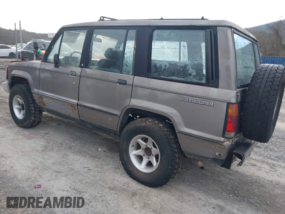 1990 Isuzu Trooper z VIN JACCH58R0L8900522, wystawiony jako IAAI lot #41642808 z przebiegiem 177 690 mil mil oraz . Historia ofert i sprzedaży dostępna na DreamBid. Obrazek 3.