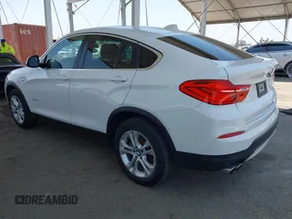 2015 BMW X4 xDrive28i with VIN 5UXXW3C5XF0M89259, listed as a IAAI auction lot 42553903 with 98,960 mi miles and . Bid and sale history available at DreamBid. Image 3.